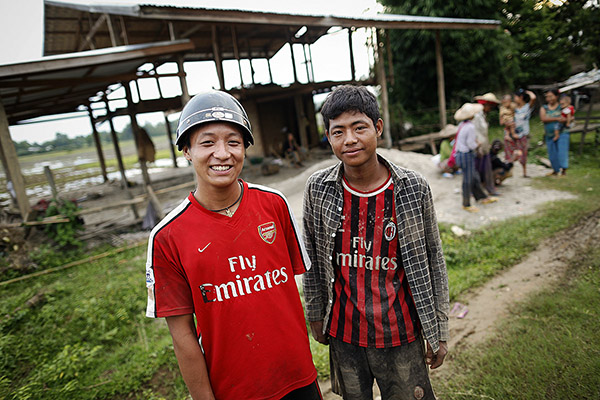 With his best friend and giggling ladies.