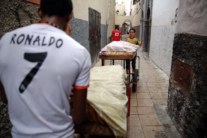 Hassan and Ronaldo delivering bread, Rabat's old town.